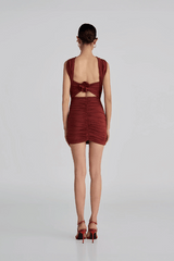 Quimera Mini Dress Chestnut by Maygel Coronel – a ruched mini with floral detail and open back. Perfect for statement styling.