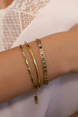 Quinn Gold Cuff Multi by Arms of Eve, a 14k gold PVD open cuff bracelet with coloured zircon stone detailing.