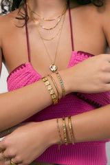 Quinn Gold Cuff Multi by Arms of Eve, a 14k gold PVD open cuff bracelet with coloured zircon stone detailing.
