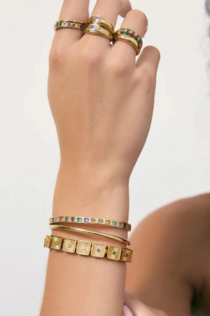 Quinn Gold Cuff Multi by Arms of Eve, a 14k gold PVD open cuff bracelet with coloured zircon stone detailing.