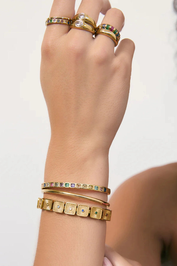 Quinn Gold Cuff Multi by Arms of Eve, a 14k gold PVD open cuff bracelet with coloured zircon stone detailing.