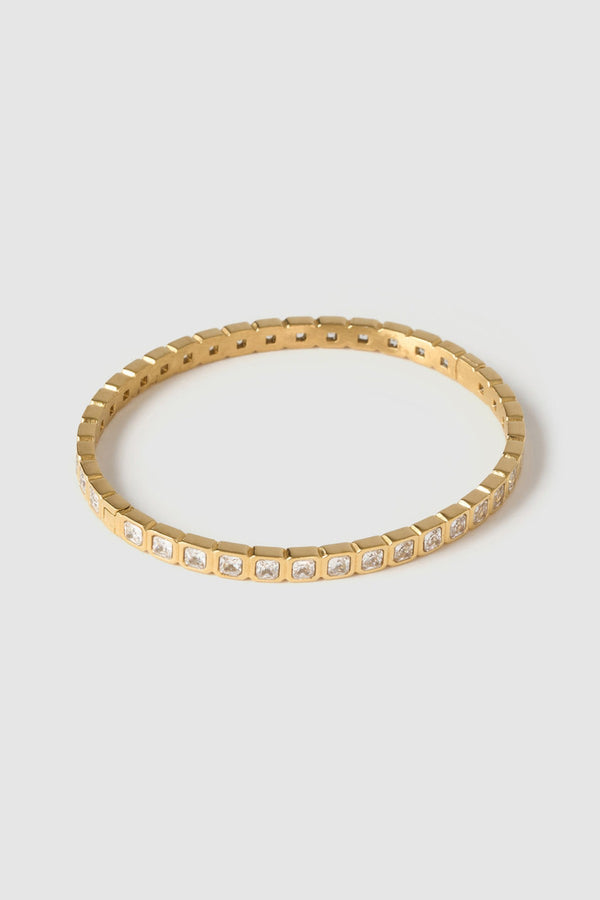 Quinn Gold Cuff Stone by Arms of Eve, a 14k gold PVD open cuff bracelet with radiant zircon stone detailing.
