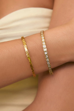 Quinn Gold Cuff Stone by Arms of Eve, a 14k gold PVD open cuff bracelet with radiant zircon stone detailing.