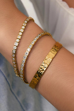 Quinn Gold Cuff Stone by Arms of Eve, a 14k gold PVD open cuff bracelet with radiant zircon stone detailing.