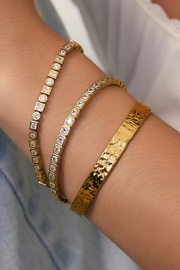 Quinn Gold Cuff Stone by Arms of Eve, a 14k gold PVD open cuff bracelet with radiant zircon stone detailing.