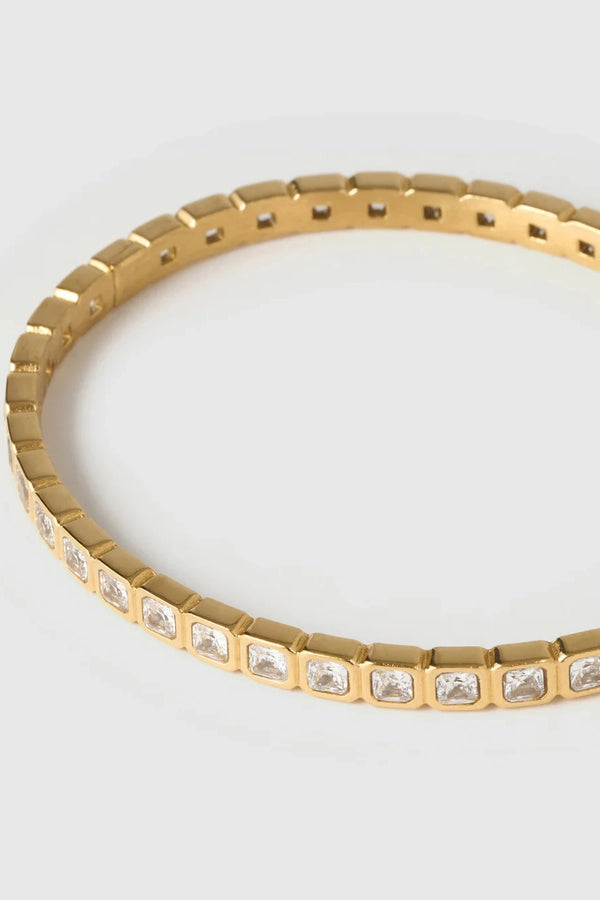 Quinn Gold Cuff Stone by Arms of Eve, a 14k gold PVD open cuff bracelet with radiant zircon stone detailing.