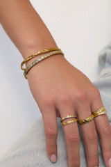 Quinn Gold Ring Stone by Arms of Eve, a 14k gold PVD stacking ring with cubic zirconia detailing.