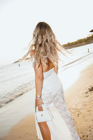 Aubrey Dress White by Natalie Rolt – Elegant lace two-piece with off-shoulder detail and cut-outs, perfect for modern brides or special soirées.