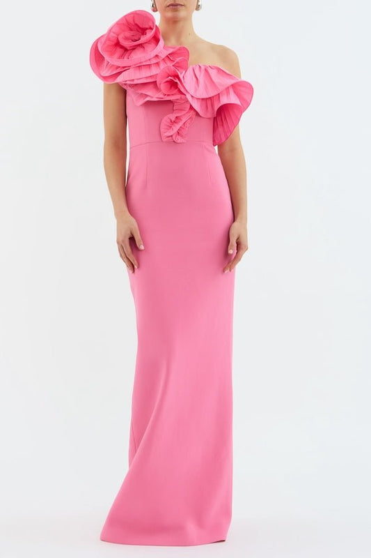 Rosita Gown Shrimp Pink by Rebecca Vallance – A taffeta one-shoulder gown with floral appliqué and back split, perfect for galas, weddings, or black-tie soirées.