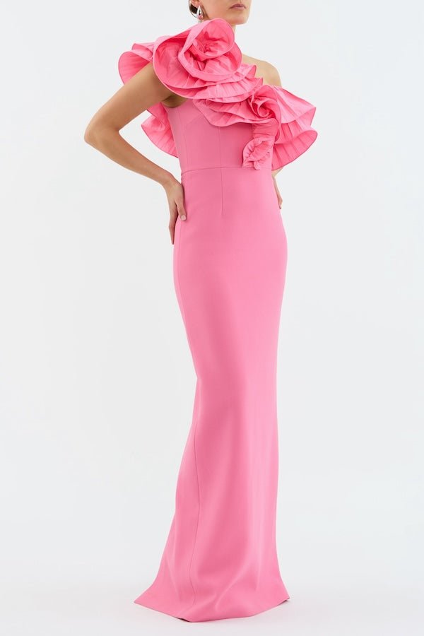Rosita Gown Shrimp Pink by Rebecca Vallance – A taffeta one-shoulder gown with floral appliqué and back split, perfect for galas, weddings, or black-tie soirées.