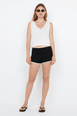 Ravyn Short Black White by Bec + Bridge, crochet mini shorts with scalloped hem. Perfect for beach days or relaxed summer outfits.