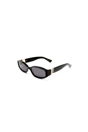 Lottie in Black by Luv Lou, luxe rectangle sunglasses with sculpted angles, gold hardware, and smoke mono CR39 lenses.