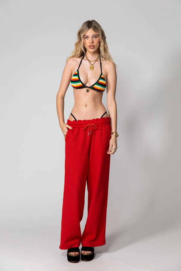 Red Knitted Baggy Pants by Something Very Special, featuring stripe jacquard and tonal embroidery. Unisex fit for everyday comfort.