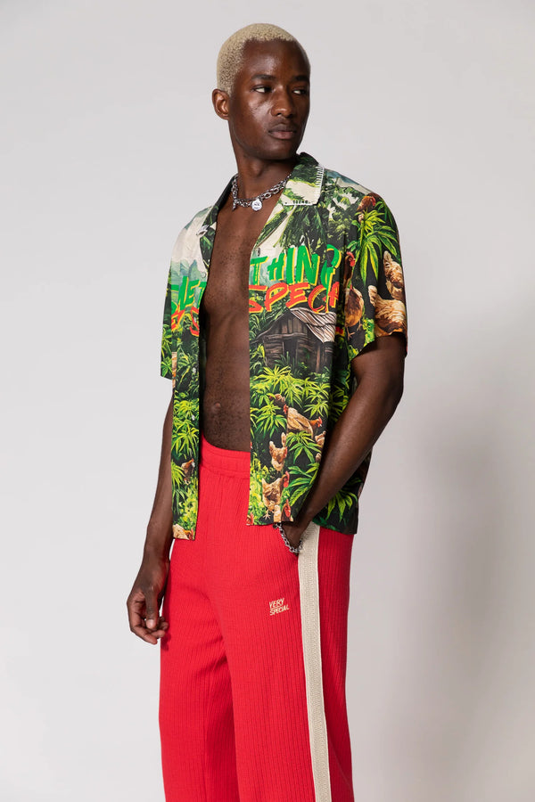 Red Knitted Baggy Pants by Something Very Special, featuring stripe jacquard and tonal embroidery. Unisex fit for everyday comfort.