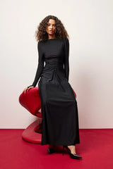 Regal Maxi Dress Black by Mossman - long sleeve jersey maxi dress with draped waist and silver U hardware, perfect for elegant evening events.