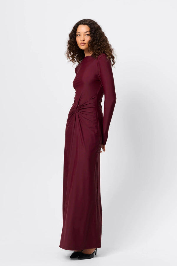 Regal Maxi Dress Bordeaux by Mossman - long sleeve jersey maxi dress with draped waist and silver U hardware, perfect for elegant evening events.