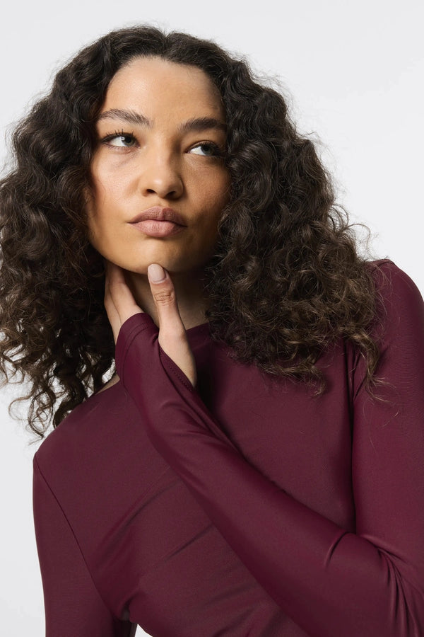 Regal Maxi Dress Bordeaux by Mossman - long sleeve jersey maxi dress with draped waist and silver U hardware, perfect for elegant evening events.