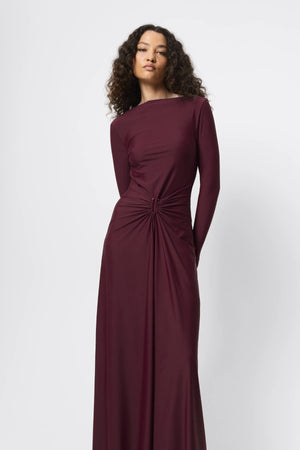Regal Maxi Dress Bordeaux by Mossman - long sleeve jersey maxi dress with draped waist and silver U hardware, perfect for elegant evening events.