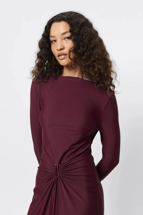 Regal Maxi Dress Bordeaux by Mossman - long sleeve jersey maxi dress with draped waist and silver U hardware, perfect for elegant evening events.