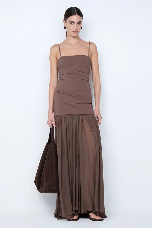 Reid Drop Waist Maxi Dress by Bec and Bridge — a milk chocolate stretch dress with a fitted bodice and sheer godet skirt, perfect for elegant evenings.