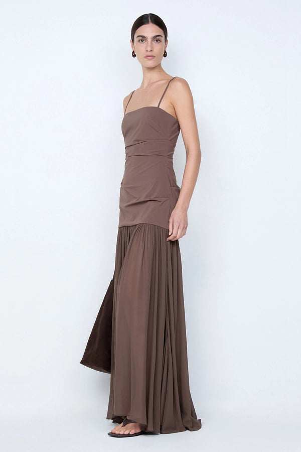 Reid Drop Waist Maxi Dress by Bec and Bridge — a milk chocolate stretch dress with a fitted bodice and sheer godet skirt, perfect for elegant evenings.