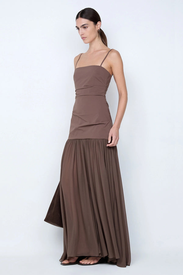 Reid Drop Waist Maxi Dress by Bec and Bridge — a milk chocolate stretch dress with a fitted bodice and sheer godet skirt, perfect for elegant evenings. 