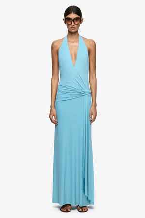 Remi Halter Dress Marine Blue by Bec + Bridge – halter maxi dress with wrap neckline and elegant open back detail.