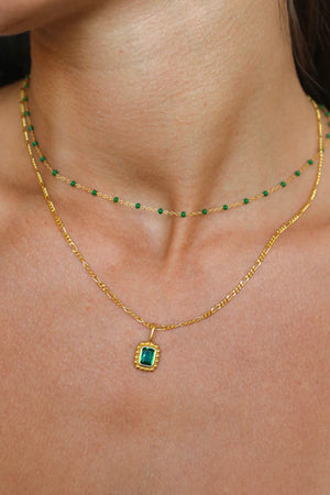 Remy Necklace Emerald by Avant Studio – 18k gold vermeil sterling silver necklace with emerald-cut cubic zirconia pendant.