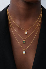 Remy Necklace Emerald by Avant Studio – 18k gold vermeil sterling silver necklace with emerald-cut cubic zirconia pendant.