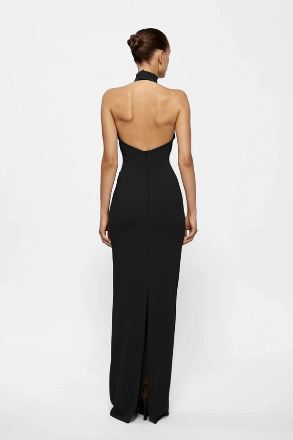 Rhi Gown in Black by Effie Kats, floor-length stretch crepe gown with open back and high neckline. Perfect for formal events and special evenings.