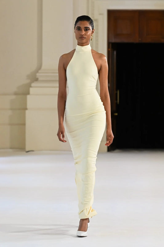 Rhi Gown in Lemon by Effie Kats, a timeless stretch crepe gown featuring a high neckline, open back, and floor-sweeping hem for effortless elegance.