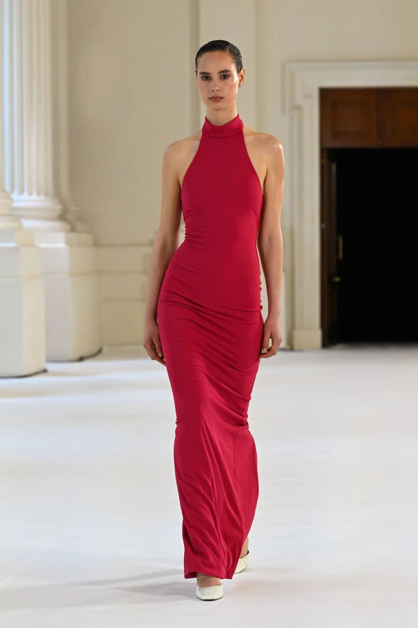 Rhi Gown in Raspberry by Effie Kats, a sleek stretch crepe gown featuring a high neckline, open back, and floor-length hemline for timeless elegance.