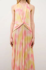 Riana Dress in Yellow Coral Rhinestone by DŽO, a halter maxi dress in abstract print with waist knot detail and subtle rhinestone embellishment.