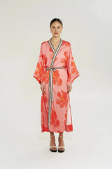 Robe in Peach Petals by Summi Summi, a flowing floral robe with wide sleeves, contrast trim, and an adjustable waist tie.