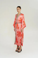 Robe in Peach Petals by Summi Summi, a flowing floral robe with wide sleeves, contrast trim, and an adjustable waist tie.