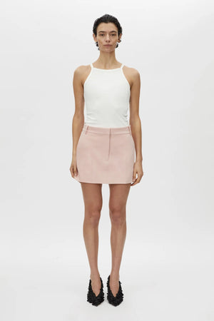 Rode Skirt by Camilla and Marc – a dusty pink tailored mini with a fishtail waistband and resin buckle, perfect for polished day-to-night looks.