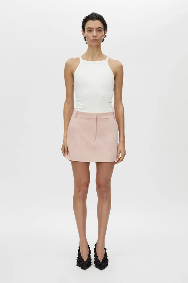 Rode Skirt by Camilla and Marc – a dusty pink tailored mini with a fishtail waistband and resin buckle, perfect for polished day-to-night looks.
