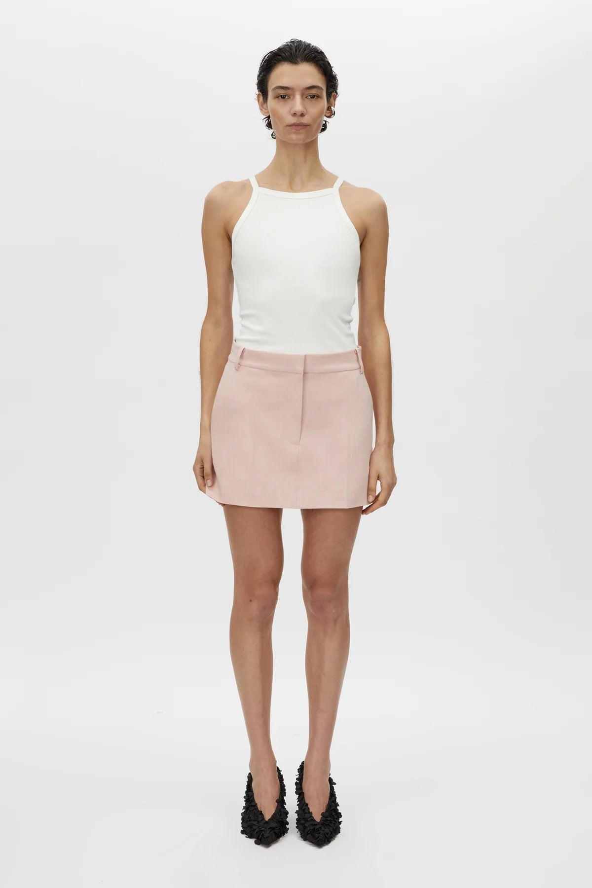 Rode Skirt by Camilla and Marc – a dusty pink tailored mini with a fishtail waistband and resin buckle, perfect for polished day-to-night looks.