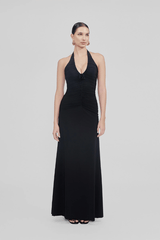 Román Dress Black by Maygel Coronel – a halter maxi with floral detail and ruched fit. Perfect for elegant event styling.