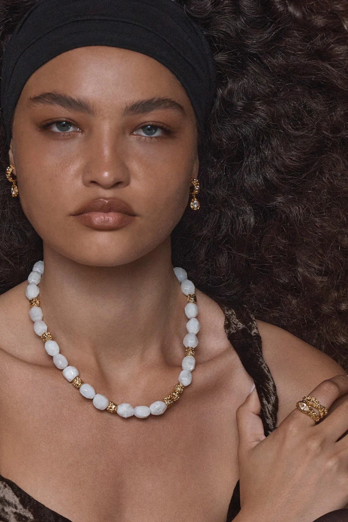 Roma Ring Gold by Amber Sceats, textured gold band with marquise-cut cubic zirconia, a trendy piece perfect for everyday elegance or chic events.