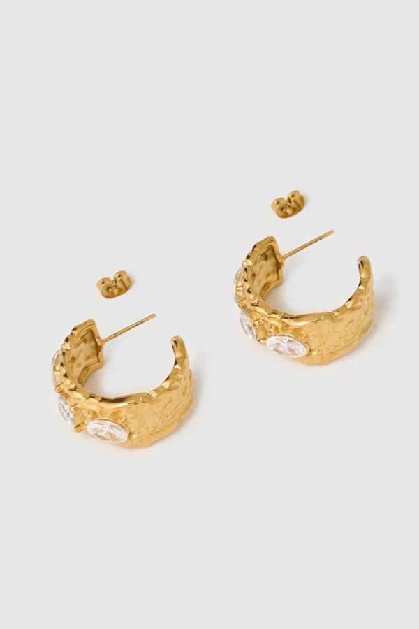 Roxy Gold Earrings by Arms of Eve, bold hoop design featuring three sparkling zircon stones for an elegant, statement-making evening look.