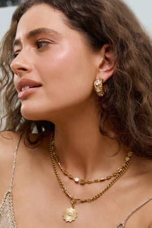 Roxy Gold Earrings by Arms of Eve, bold hoop design featuring three sparkling zircon stones for an elegant, statement-making evening look