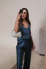 Ruby Top Coal by Sneaky Link – a scoop neck tank with fluid drape and lightweight feel. Perfect for day-to-night styling.