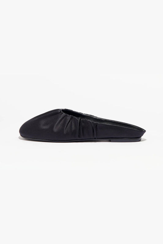 Rue in Black Satin by Alias Mae, a mule-style ballet flat with ruched topline and leather lining.
