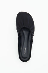 Rue in Black Satin by Alias Mae, a mule-style ballet flat with ruched topline and leather lining.