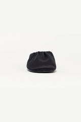 Rue in Black Satin by Alias Mae, a mule-style ballet flat with ruched topline and leather lining.