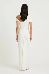 Rumi Maxi Dress by Benni — an asymmetric stretch jersey dress with a gathered skirt and cascading split, perfect for elevated evenings.