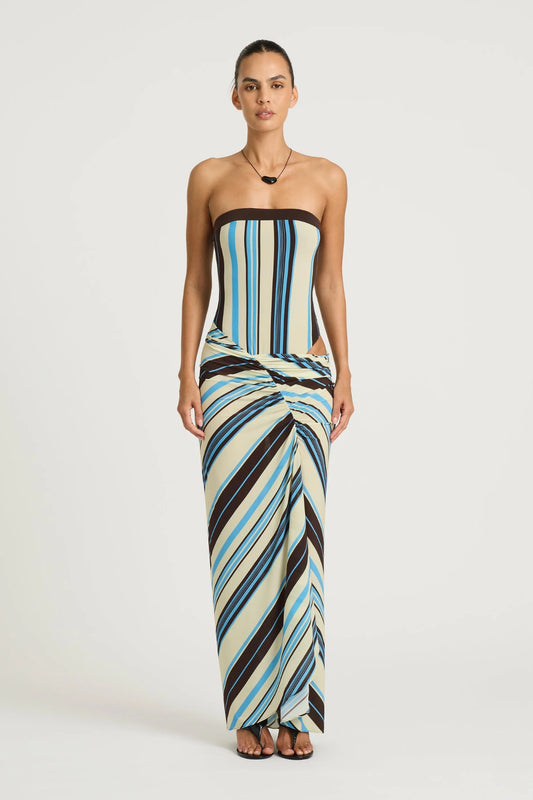Rumi Strapless Maxi Dress by Benni, ocean stripe asymmetric one-shoulder maxi with gathered skirt, adjustable cut-out and sculpting stretch fit.