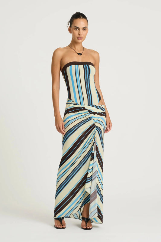 Rumi Strapless Maxi Dress by Benni, ocean stripe asymmetric one-shoulder maxi with gathered skirt, adjustable cut-out and sculpting stretch fit.