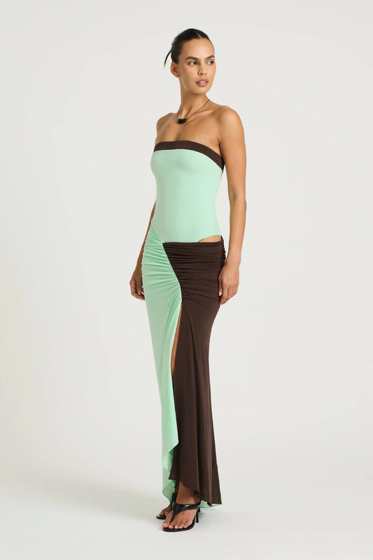 Rumi Strapless Maxi Dress in Aqua/Choc by Benni, ocean stripe asymmetric one-shoulder maxi with gathered skirt, adjustable cut-out and sculpting stretch fit.
